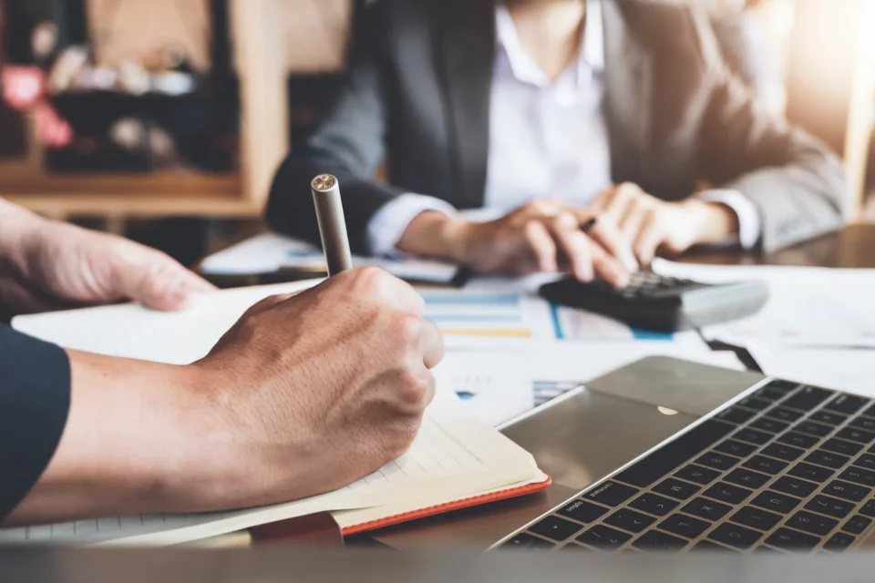 close up of hands of team members working together
