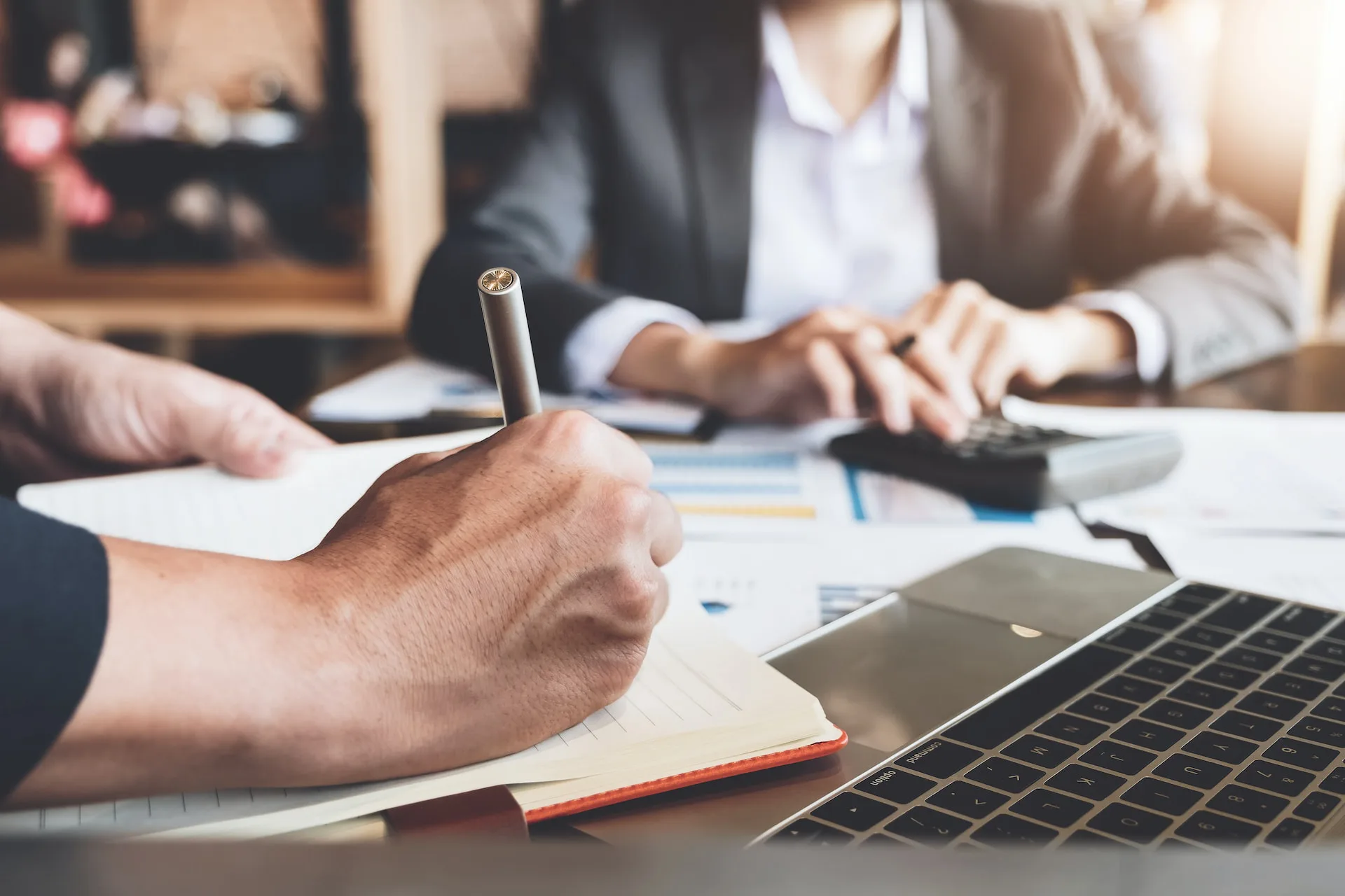 close up of hands of team members working together