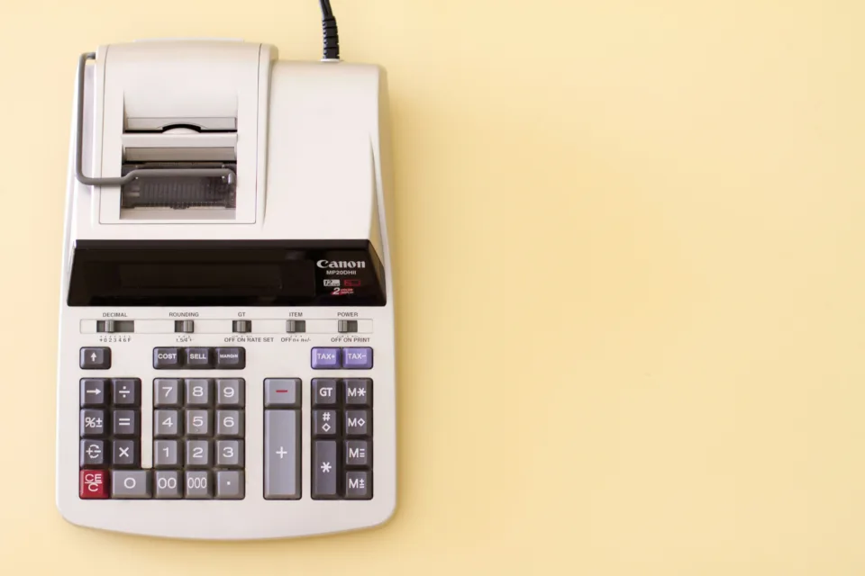 adding machine on yellow background