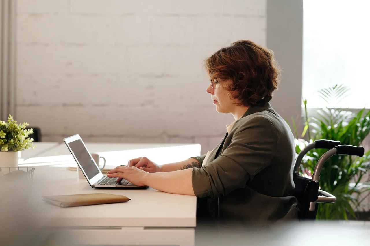 woman working on laptop at desk